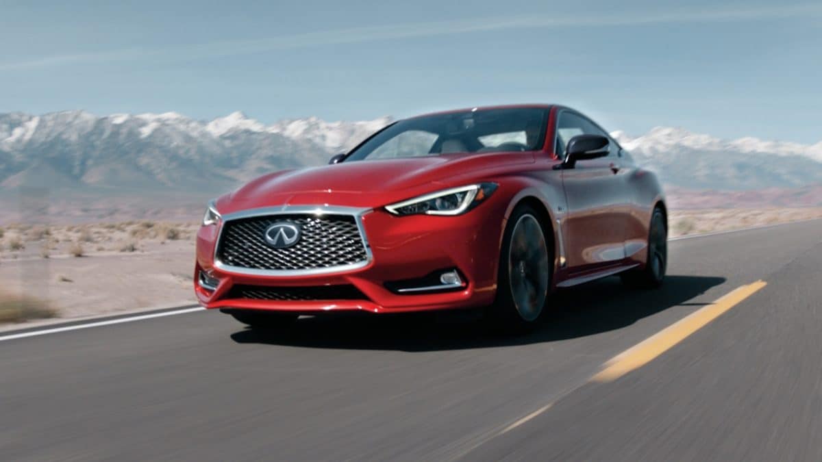 Exterior Front Profile View Of The 2020 INFINITI Q60 RED SPORT 400 Luxury Coupe Driving On Highway